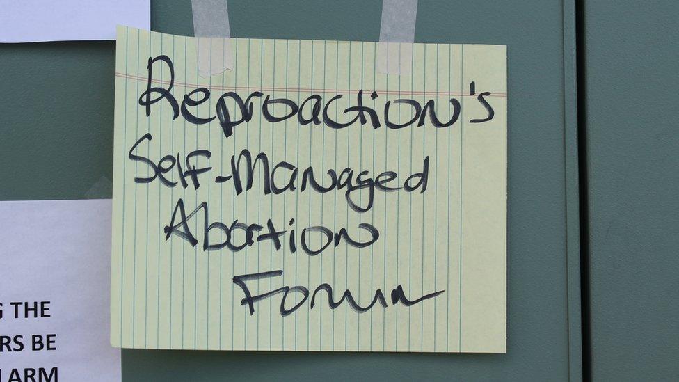 A sign that reads "Reproaction's self-managed abortion forum"