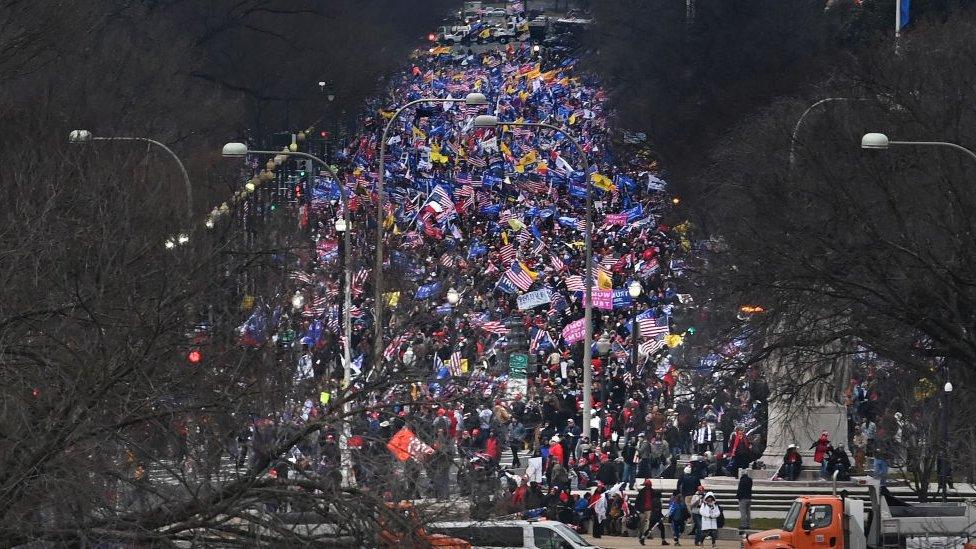 Trump supporters march from the White House to the Capitol