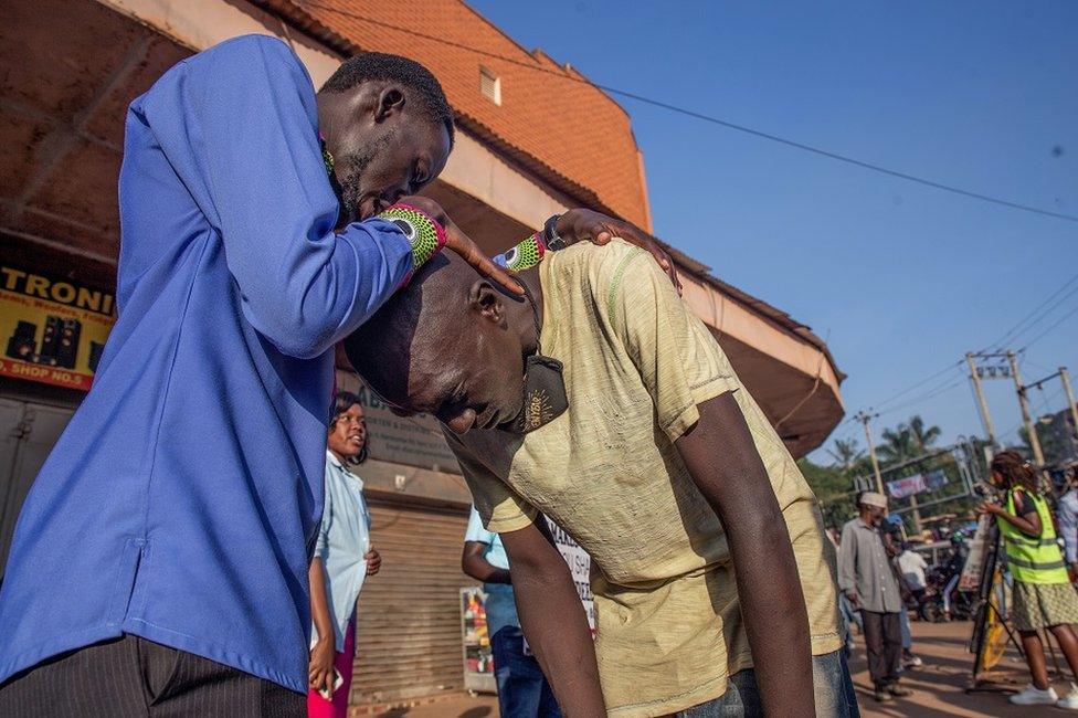 A man being blessed