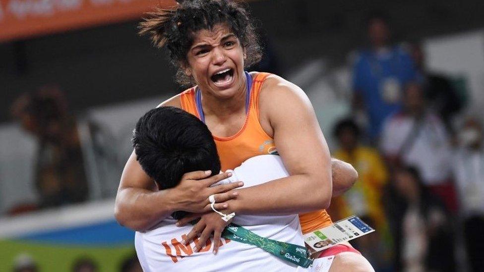 India"s Sakshi Malik celebrates after winning against Kirghyzstan"s Aisuluu Tynybekova in their women"s 58kg freestyle bronze medal match on August 17, 2016,