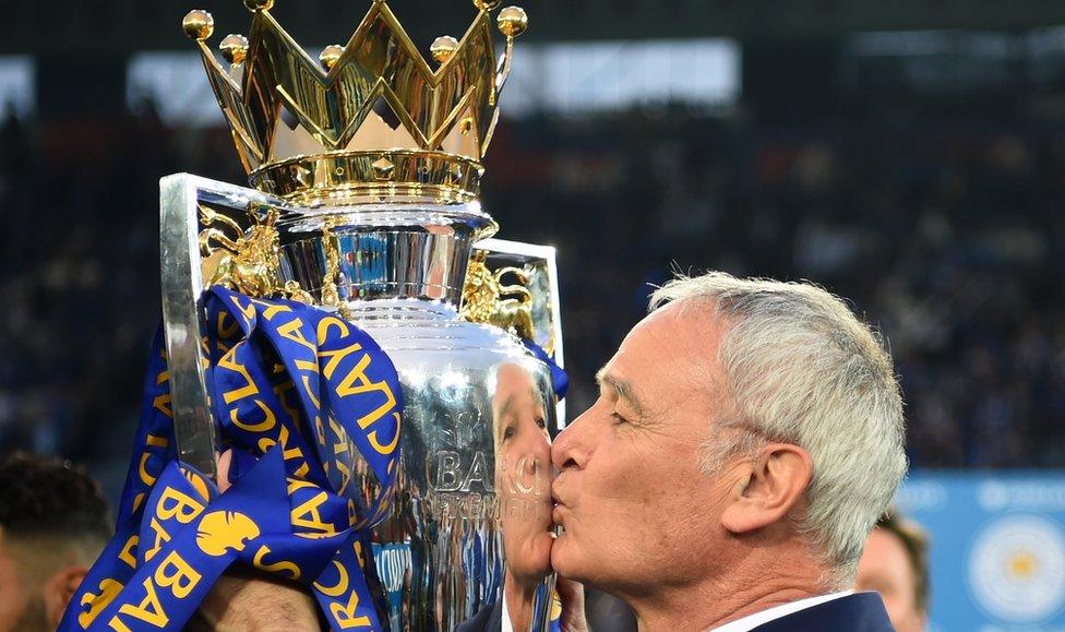 Claudio Ranieri kisses the Premier League trophy