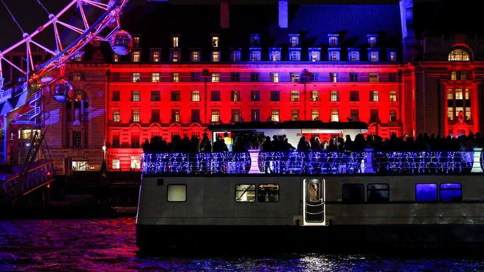 Party boat sails past London Eye