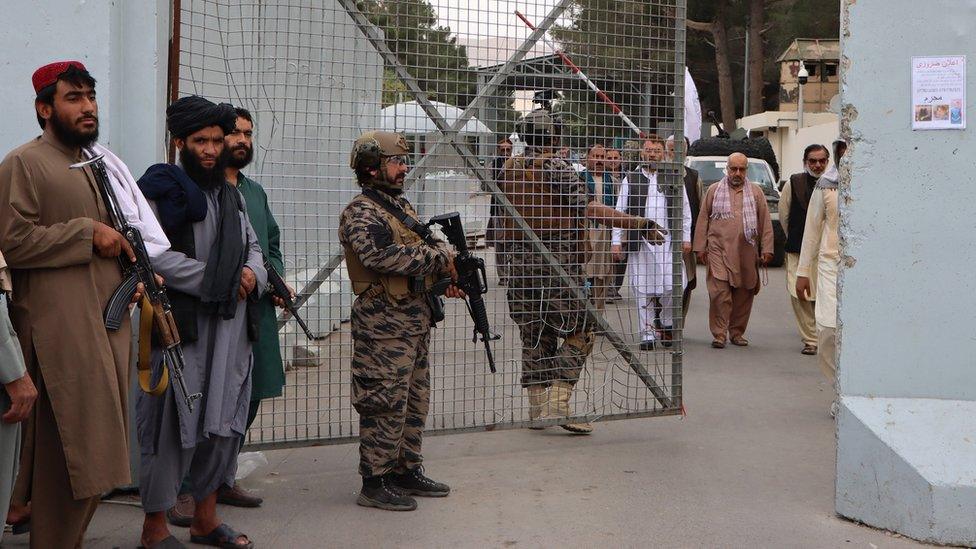 Taliban fighters stand guard outside the Hamid Karzai International Airport, in Kabul, Afghanistan, 1 September, 2021