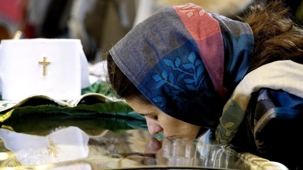 Orthodox believer pays last respect to the late Serbian Patriarch Irinej on November 21, 2020 in Belgrade