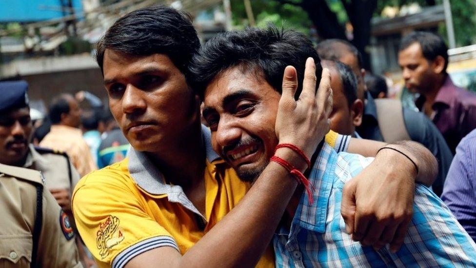 A relative of a stampede victim grieves at a hospital in Mumbai, India September 29, 2017