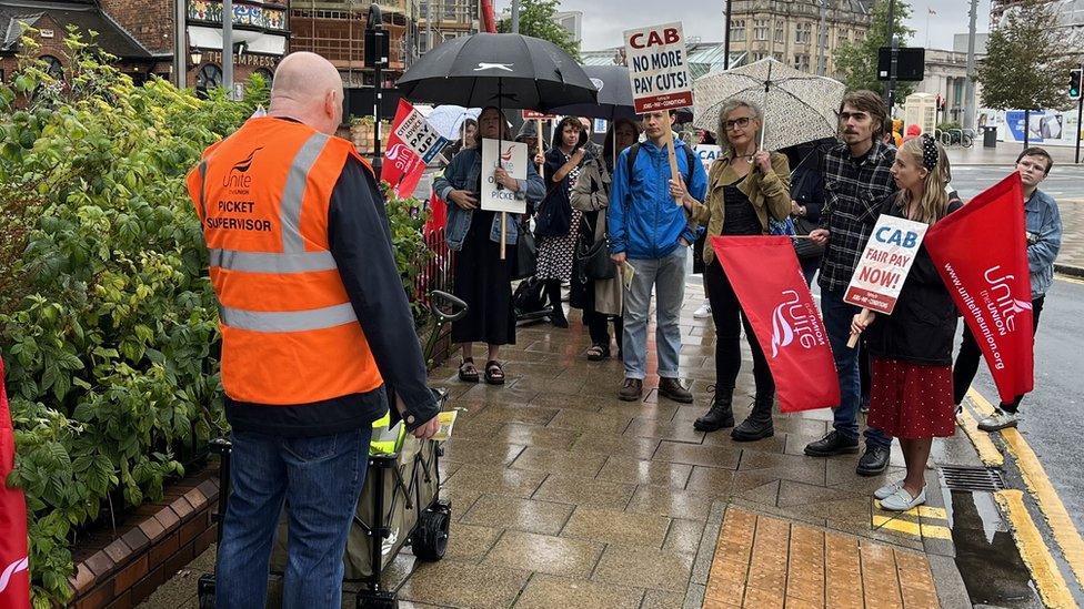 Citizens Advice Hull and East Riding workers at their picket line outside The Wilson Centre in Hull city centre, on 31 July