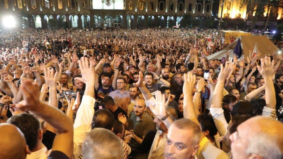 An anti-government rally outside parliament in Tbilisi, Georgia