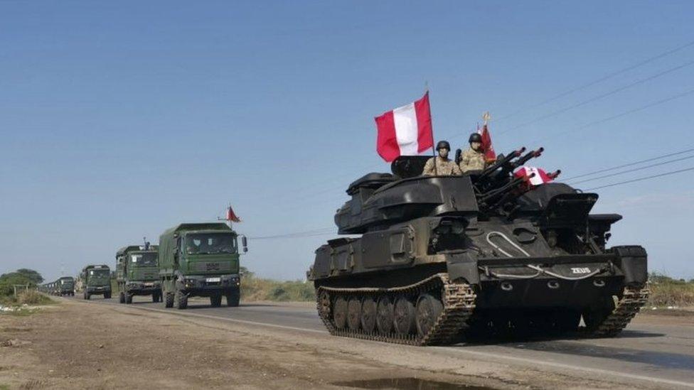 A handout photo made available by the Peruvian News Agency (Andina) of armoured units of the Peruvian Army that are heading to the border with Ecuador in support of the National Police to control the access of migrants in Tumbes, Peru, 26 January 2021.