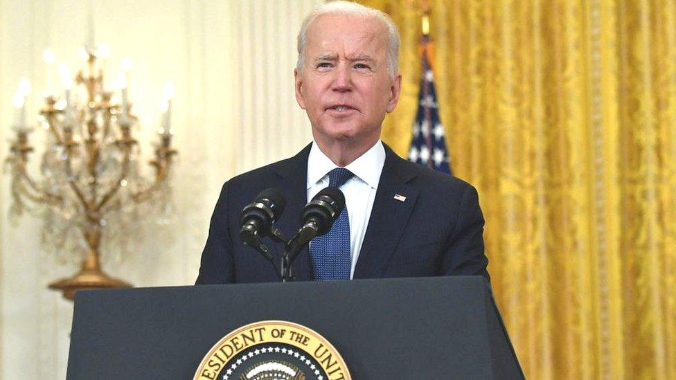 US President Joe Biden answers questions about the fuel pipeline cyber-attack during a speech about the economy at the White House