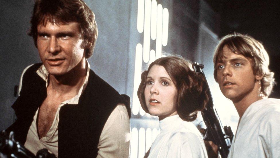 From left, Harrison Ford, Carrie Fisher, and Mark Hamill are shown in a scene from Star Wars