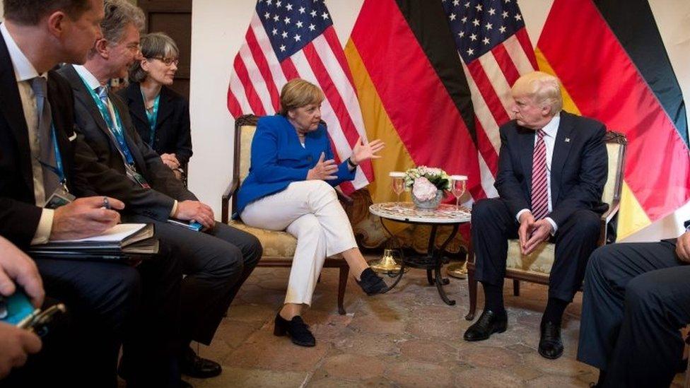 German Chancellor Angela Merkel and US President Donald Trump (both centre) talk during a G7 meeting in Taormina, Sicily. Photo: 26 May 2017