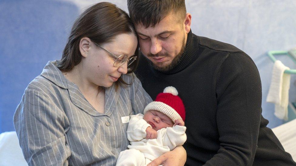 New parents Nadejda Bulgaru, 25, and Stefan Dobroviceanu, 31, from Edinburgh, with their baby daughter Selena, who was born at 02:44am on Christmas Day morning at Edinburgh Royal Infirmary