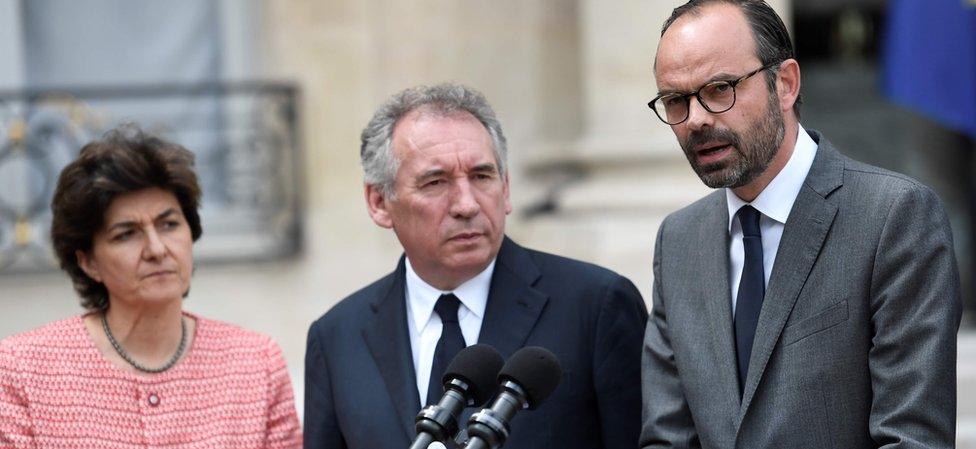 French Prime Minister Edouard Philippe (R) speaks flanked by French Minister of the Armed Forces Sylvie Goulard (L) and French Minister of Justice François Bayrou after the weekly cabinet meeting on May 24, 2017