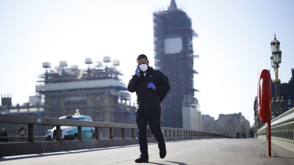 Picture showing a man crossing a bridge in London