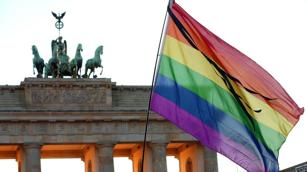 File pic of rainbow flag at Brandenburg Gate in Berlin