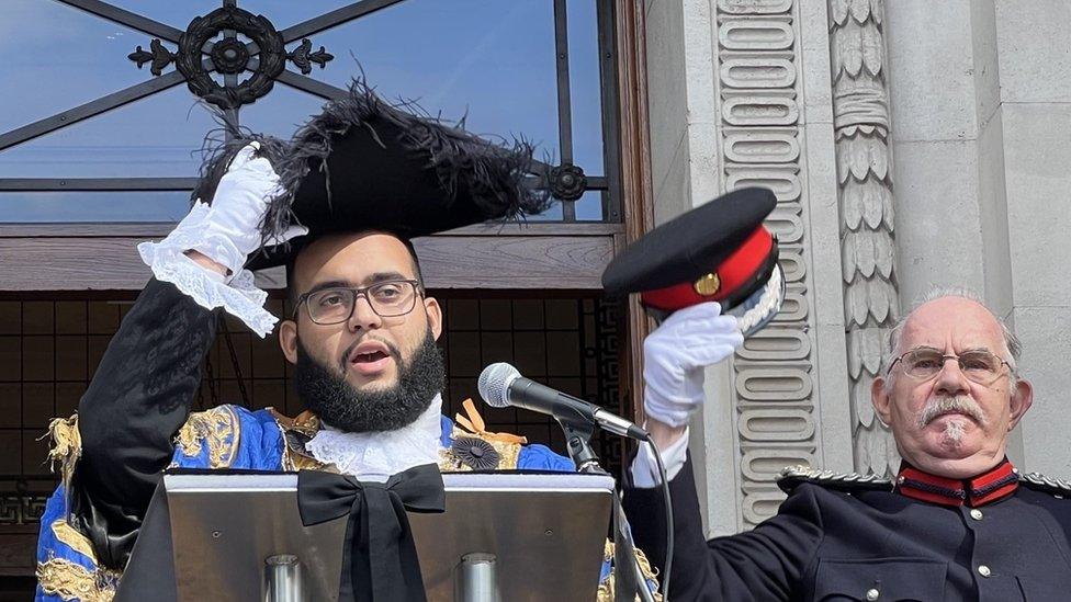 Councillor Taouzzale reads out the proclamation on the steps of Old Marylebone Town Hall