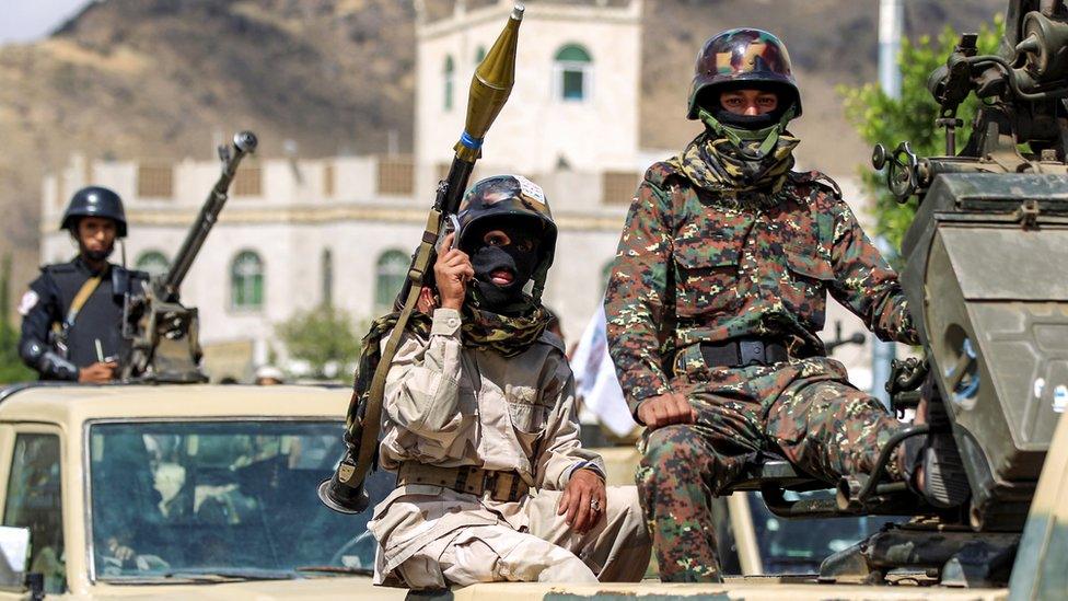 Yemeni soldiers loyal to the Shiite Huthi rebels ride on military vehicles during a parade in the capital Sanaa on October 16, 2018