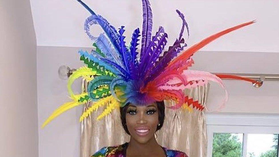 Lystra Adams with a multi-coloured fascinator