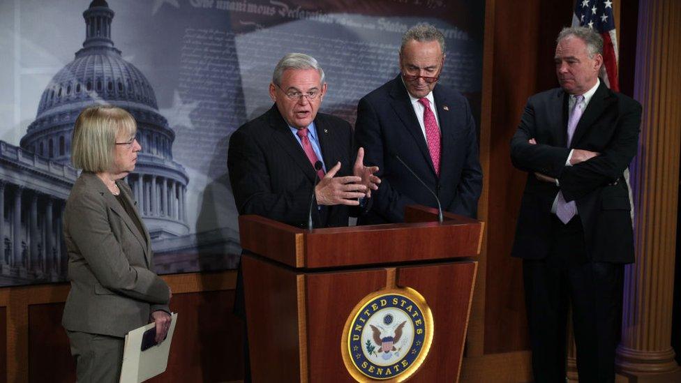 Senator Menendez speaks to reporters at a press conference with other Democrats