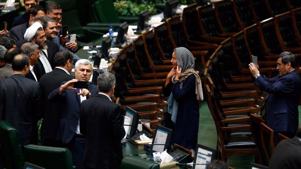 Iranian lawmakers take souvenir picture with EU foreign policy chief Federica Mogherini at the Iranian parliament after president Hassan Rouhani was sworn-in for his second four-year term of presidency, at the parliament in Tehran, Iran