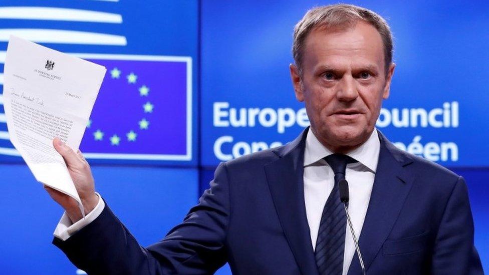 European Council President Donald Tusk shows Theresa May's Brexit letter following a news conference in Brussels