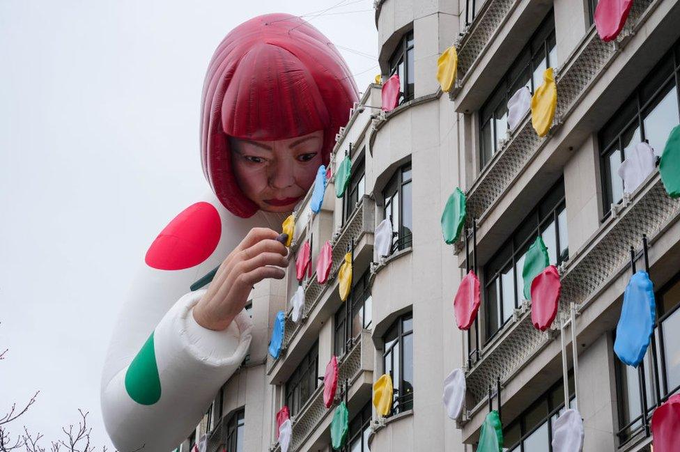 A Yayoi Kusama sculpture is displayed on the top of the Louis Vuitton's Champs Elysees store, on January 12, 2023 in Paris, France.