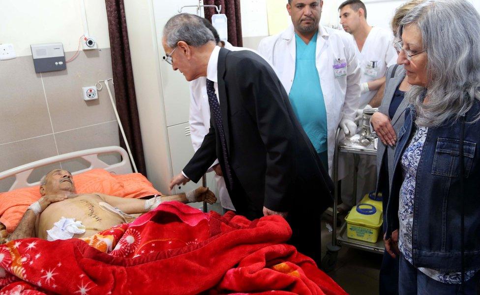 Kirkuk provincial Governor, Najm al-Din Karim visits victims injured in attacks carried out by Islamic State (IS) group jihadists, at a hospital in the Kurdish-controlled city of Kirkuk on October 24, 2016.