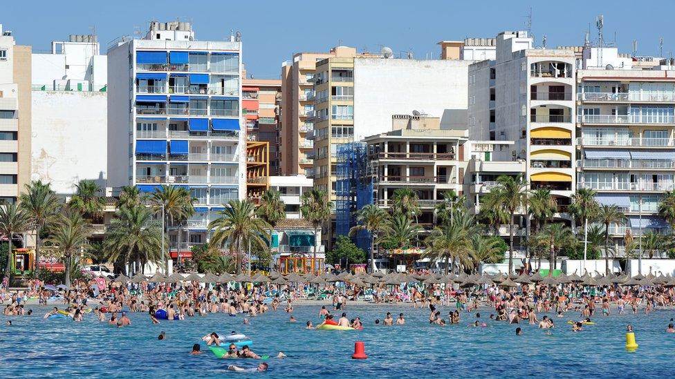 General view of holidaymakers along the beach in El Arenal in Palma de Mallorca on 17 June 2011