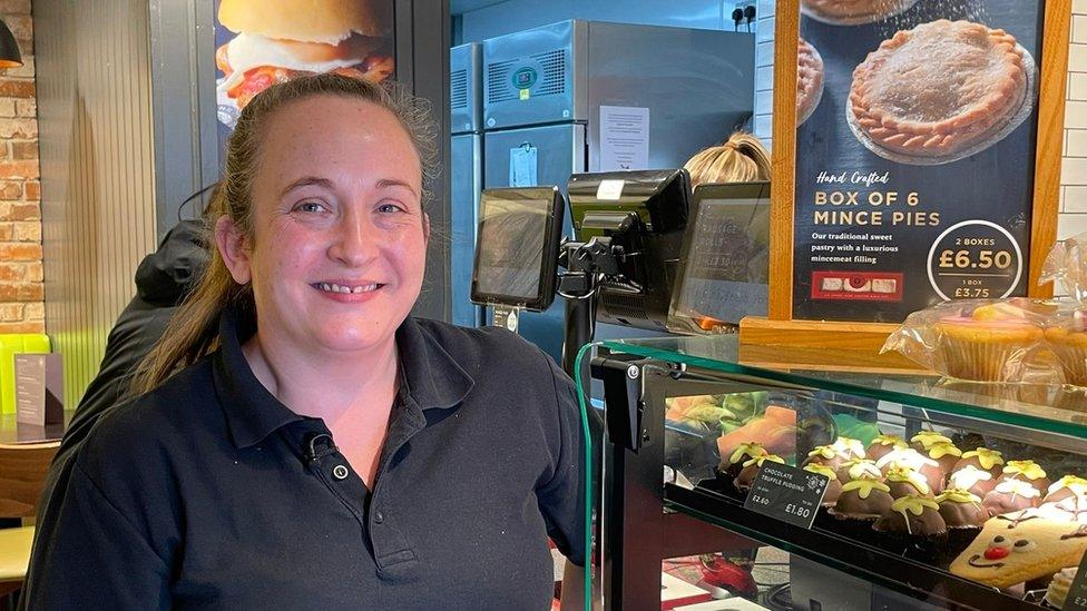 Lena Lloyd-Jones in a bakers with mince pie sign behind her