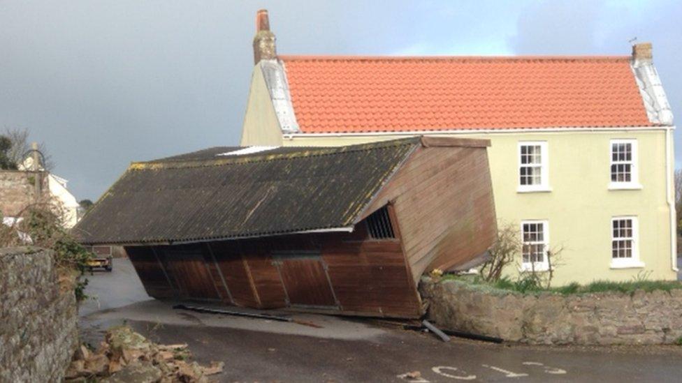 Stable on top of a house wall in Alderney