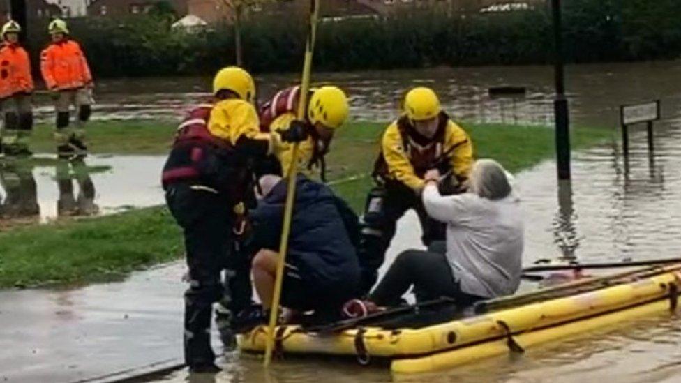 A couple being evacuated from flood-hit Catcliffe