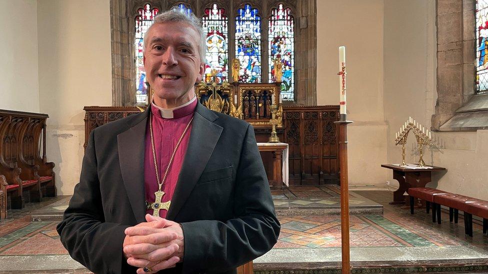 Archbishop of Wales, the Most Reverend Andrew John, at the high altar in St Deiniol's Cathedral in Bangor, Gwynedd