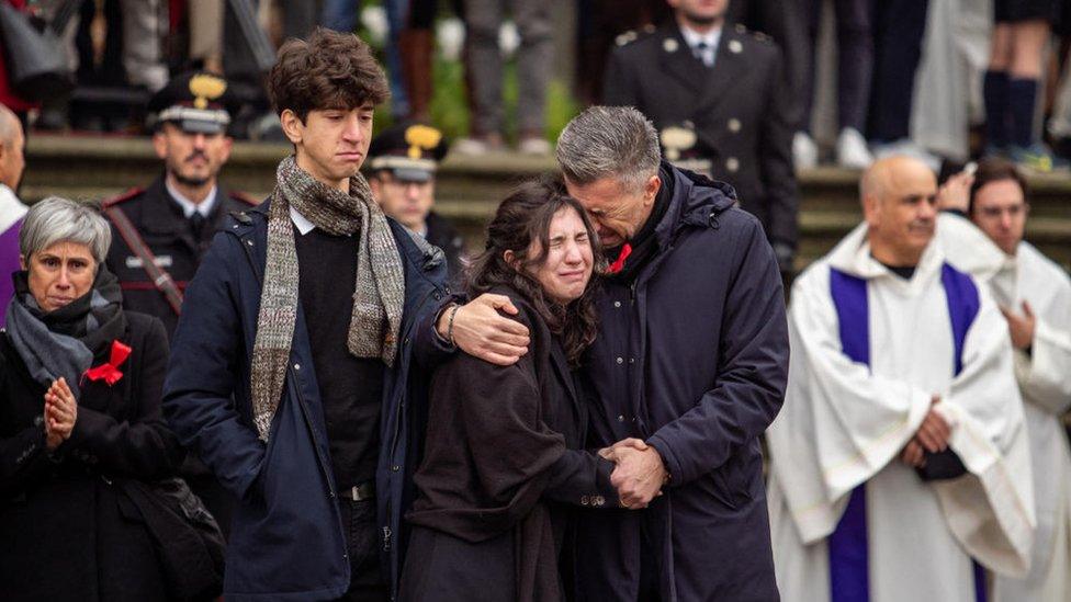 Gino Cecchettin (R), Elena Cecchetin (C) and Davide Cecchettin (L), respectively father, sister and brother of Giulia Cecchettin attend her funeral ceremony in Padua, on December 5, 2023.