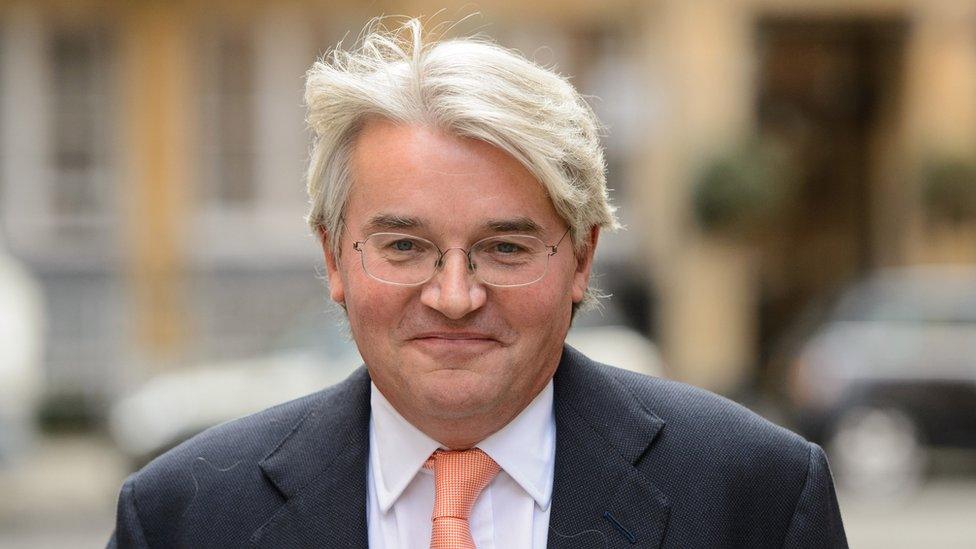 Andrew Mitchell MP walks along a road