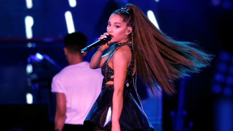 Ariana Grande performing on stage.