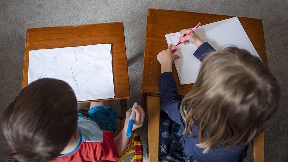 Two kids working at home