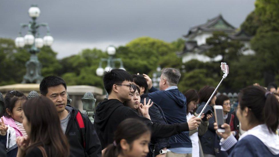 Crowds taking pictures outside the Imperial Palace