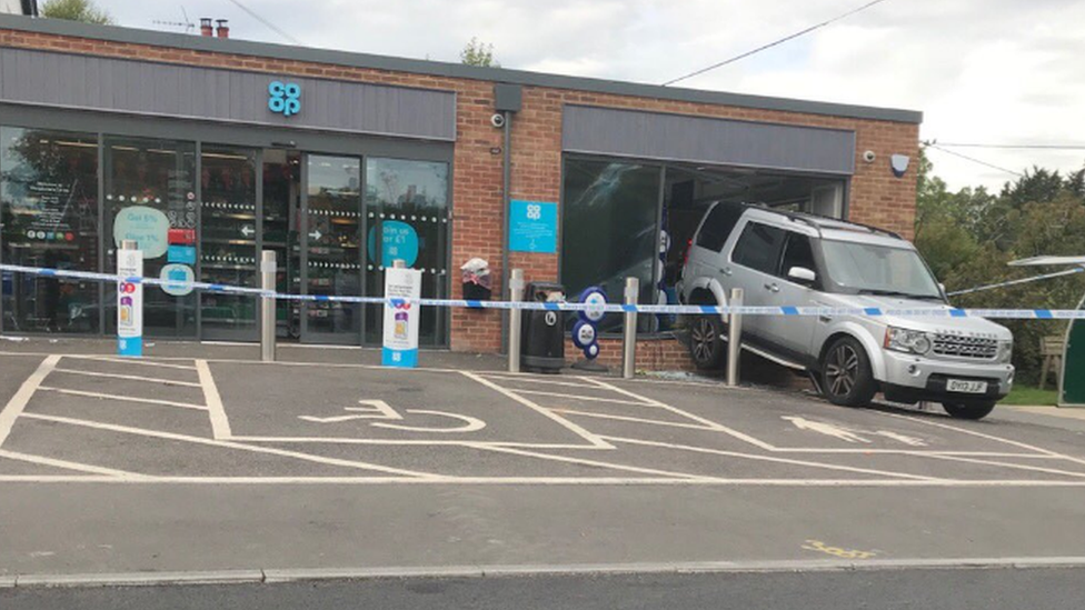 The stolen Land Rover in the window of the Co-operative store in Woodcote