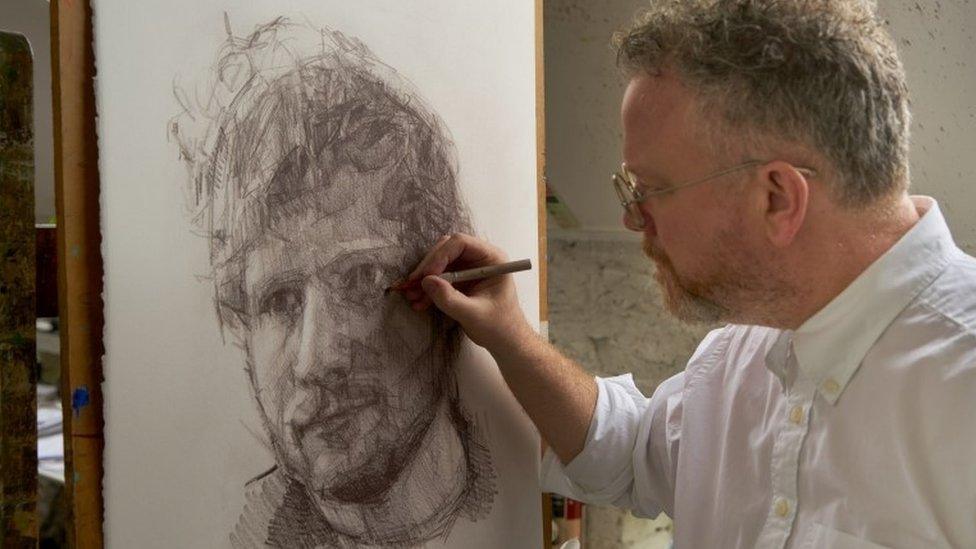 Colin Davidson drawing a portrait of Ed Sheeran