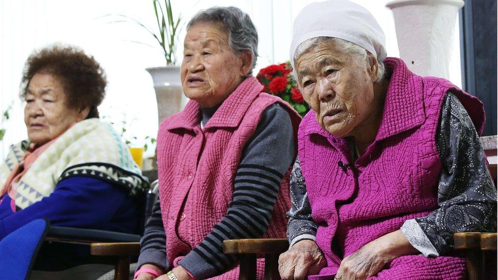 South Korean elderly women who were forced to serve as sex slaves watch a broadcast of a joint press briefing of South Korea and Japan Foreign Ministers on 28 December