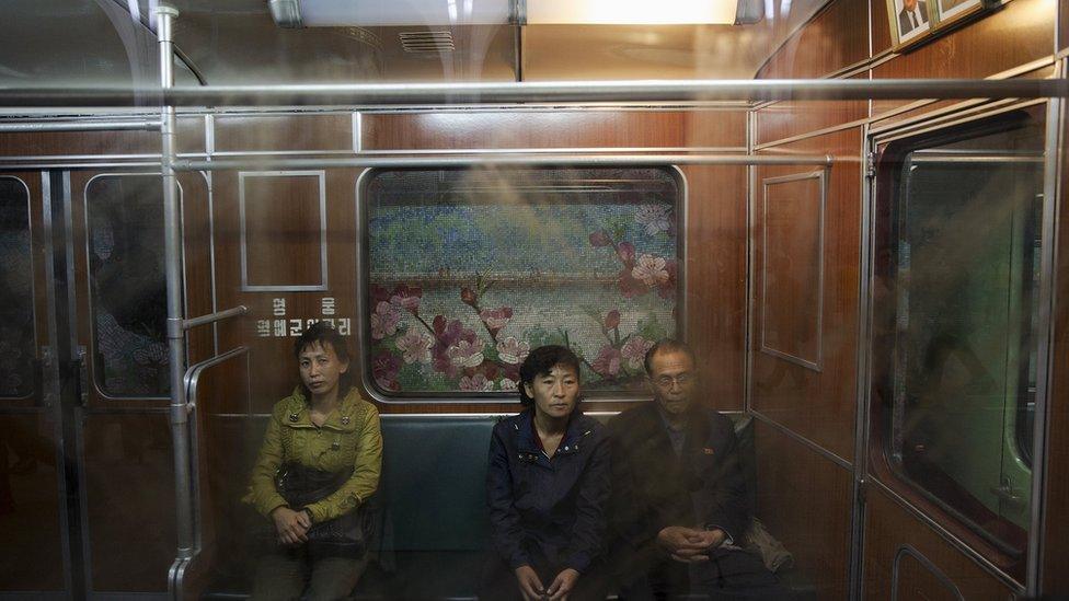 Passengers travel on a train that stopped at a subway station visited by foreign reporters during a government organised tour in Pyongyang, North Korea, October 9, 2015.