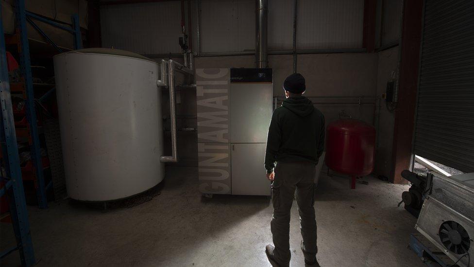 Man standing by boiler