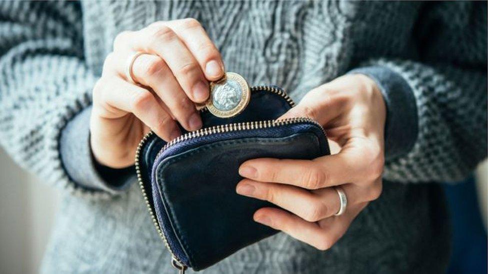 Lady taking change from purse