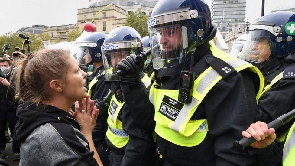 Protesters and police at a "We Do Not Consent" rally at Trafalgar Square in London