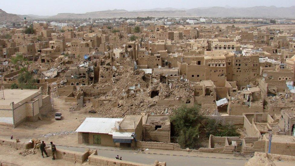 Heavily damaged buildings in the war-battered city of Saada