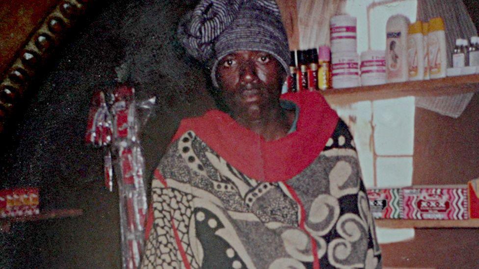 A photograph of Supang Khoaisanyane with a hat and wearing a Basotho blanket.