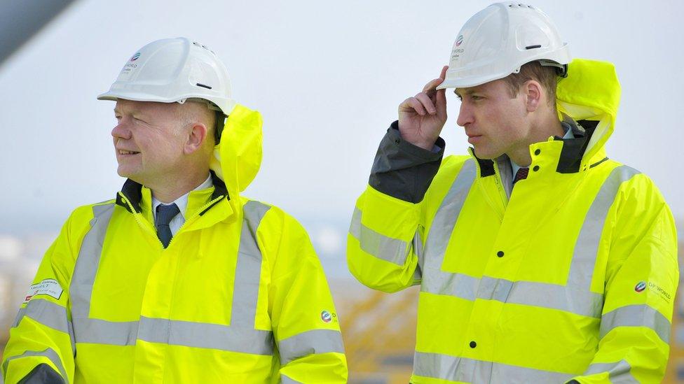 The Duke of Cambridge (r) looks out over container stacks with Lord Hague during a visit to the London Gateway port