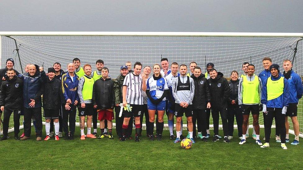 Members of the Rebound with Rovers group pictured by a goalpost