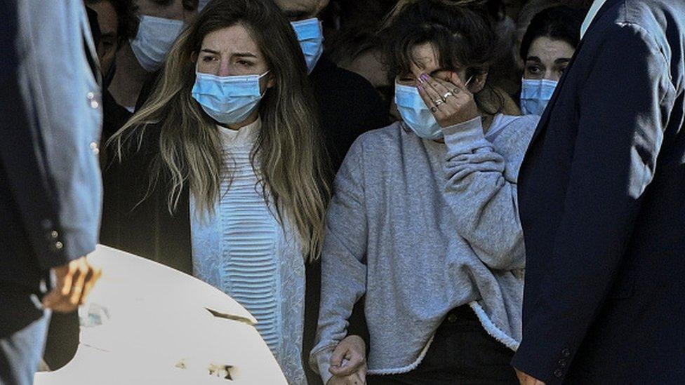 The daughters of the late Argentine football legend Diego Maradona, Dalma (L) and Giannina, leave the Casa Rosada presidential palace