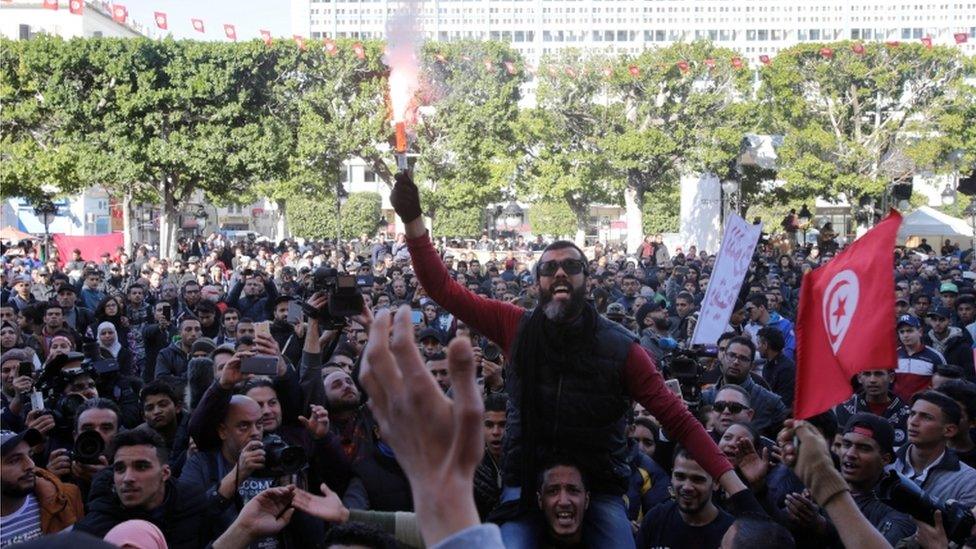 People shout slogans during demonstrations on the seventh anniversary of the toppling of president Zine El-Abidine Ben Ali, in Tunis, Tunisia January 14, 2018